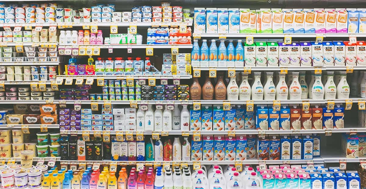 Assorted grocery products on a refrigerator shelf, representing the target market for a CPG marketing agency.