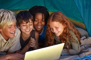 Group of friends enjoying OTT content on a laptop